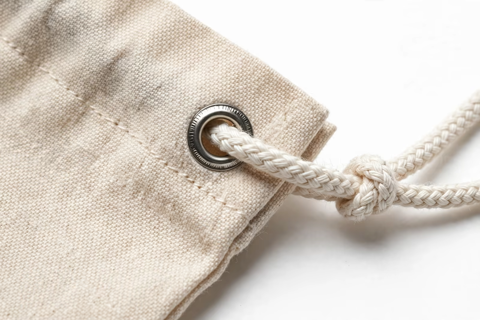 Drawstring cord through a metal eyelet close-up from a manufacturer in Bangladesh