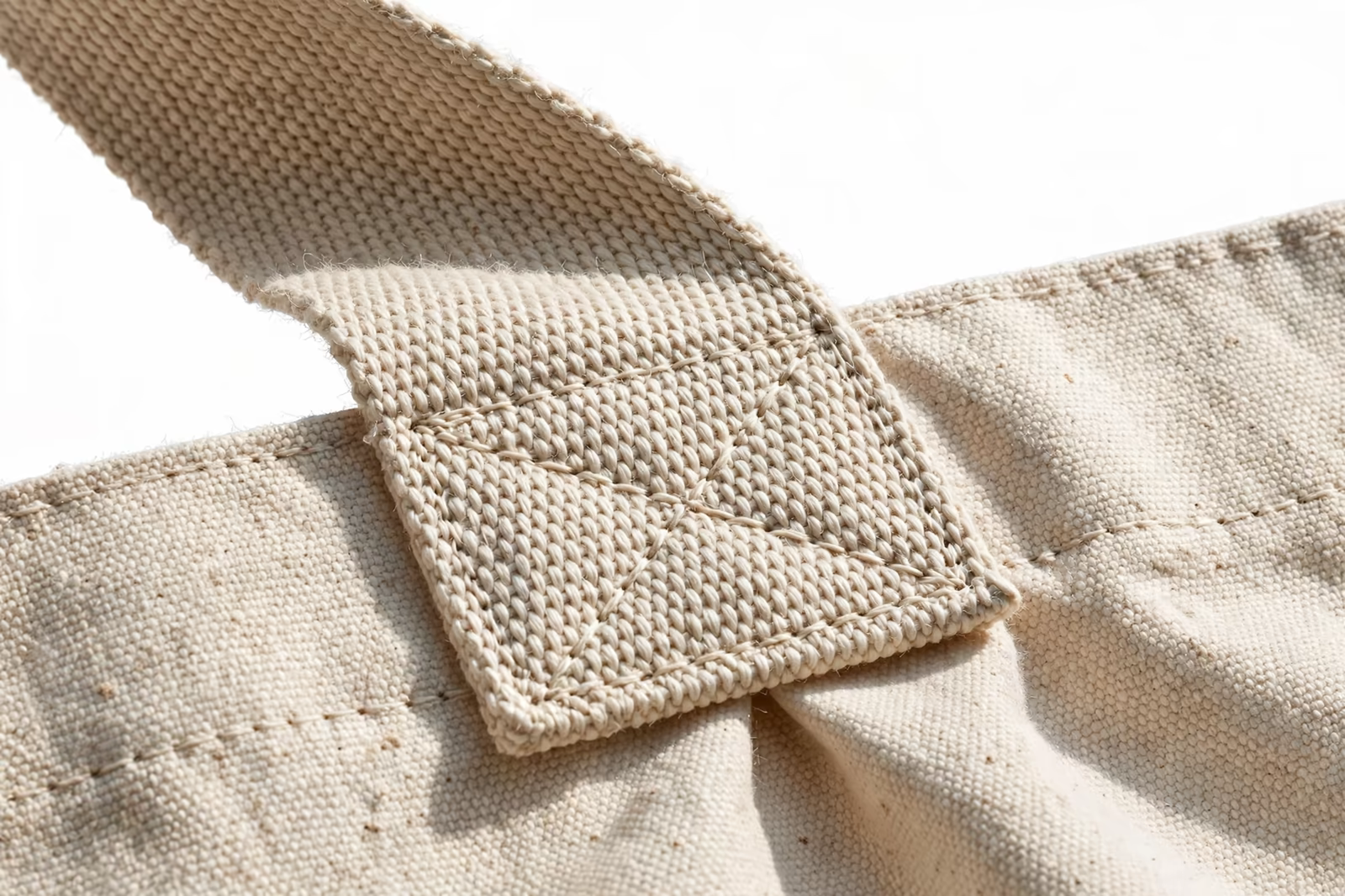 Reinforced X-box handle stitching on a canvas tote bag from a manufacturer in Bangladesh