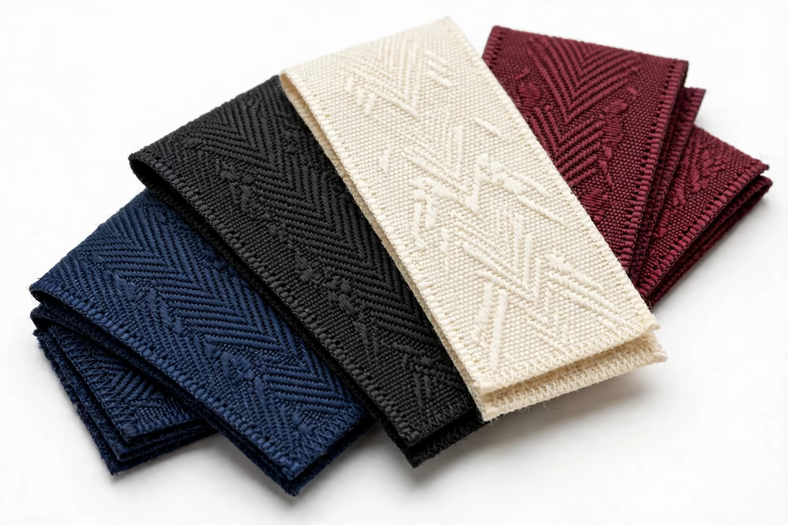 Woven damask labels in four colours from a manufacturer in Bangladesh